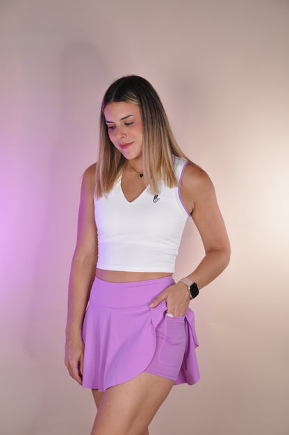 Conjunto top con cuello y falda asimetrica