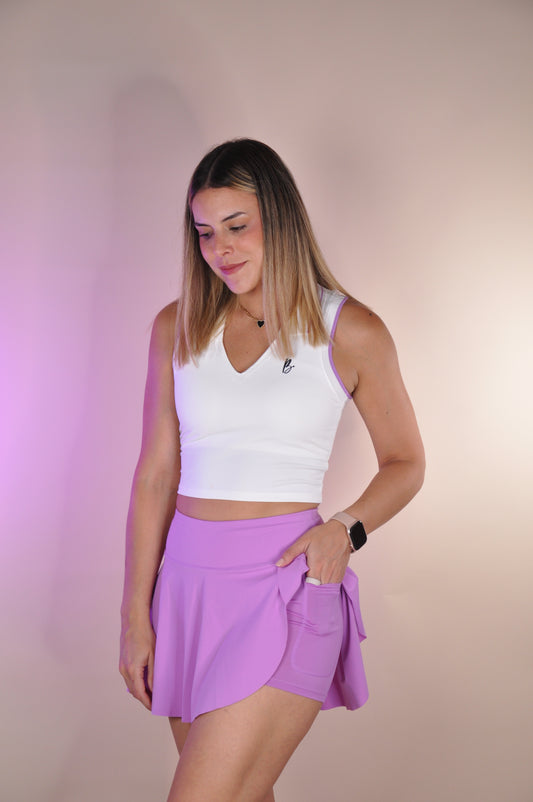 Conjunto top con cuello y falda asimetrica