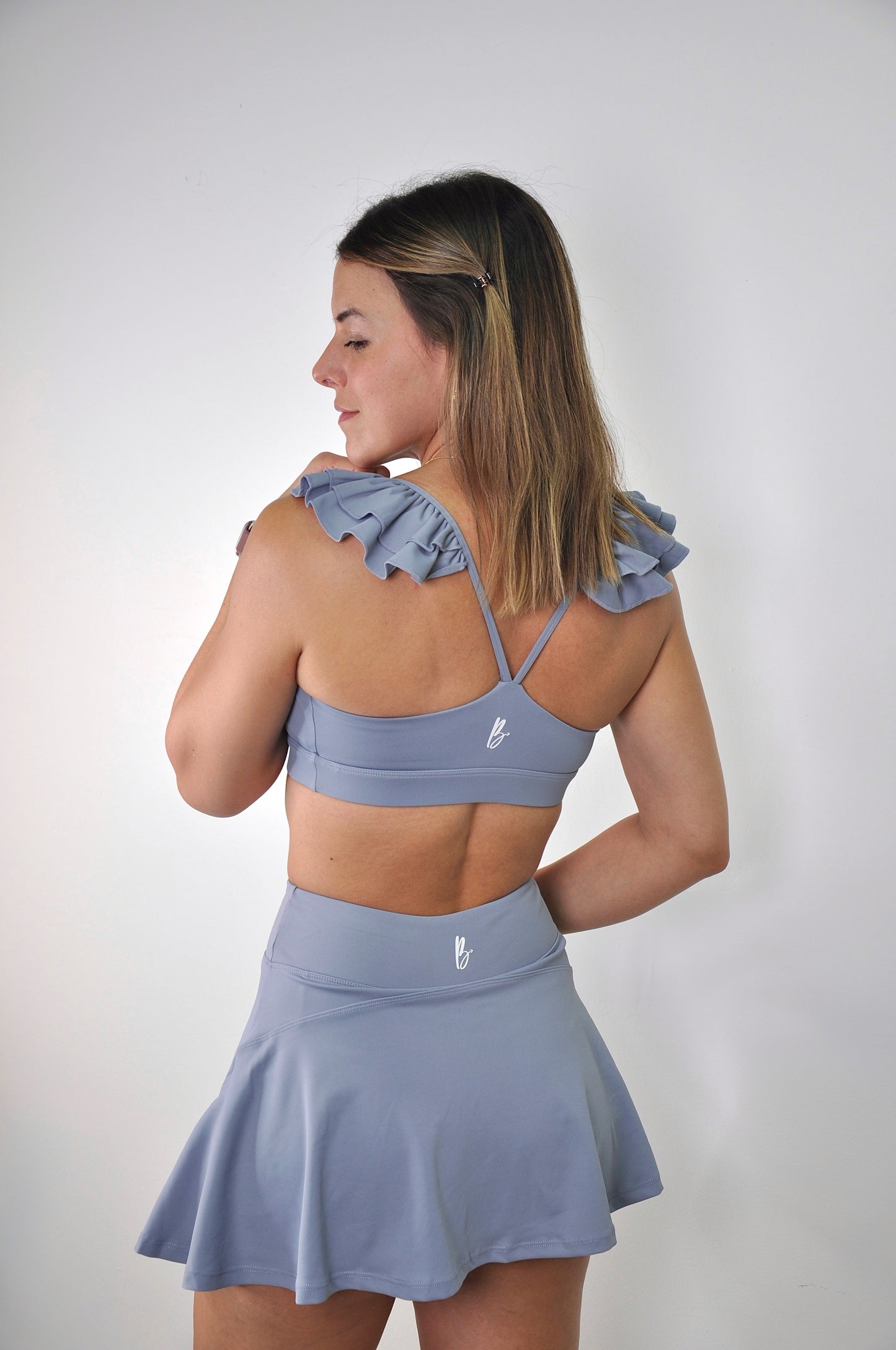 Conjunto top de vuelos y falda