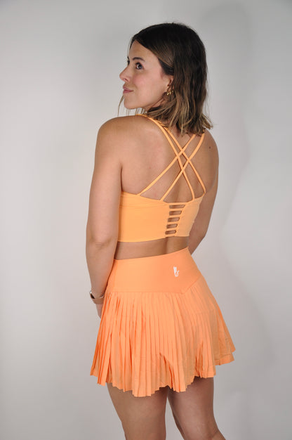 Conjunto top backless y falda plisada